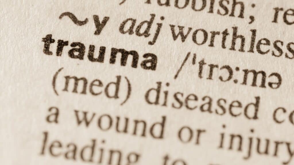 Trauma definition written in a dictionary.
